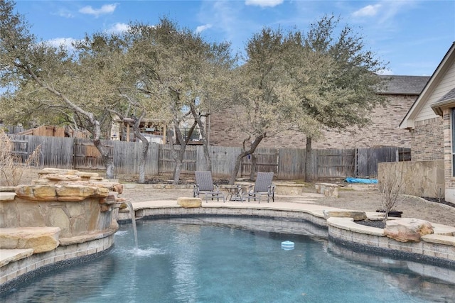 view of swimming pool featuring a patio and fence