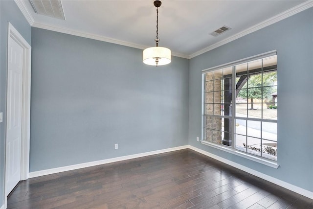 spare room featuring dark wood-style floors, a healthy amount of sunlight, visible vents, and baseboards