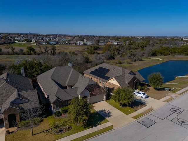 aerial view with a residential view and a water view