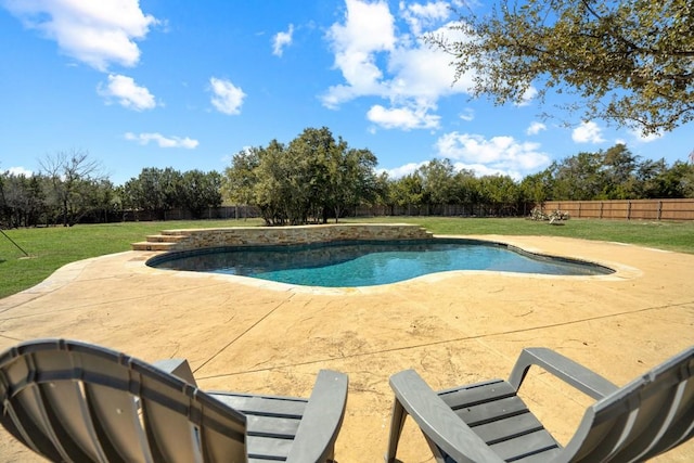 view of swimming pool featuring a fenced in pool, a patio area, a yard, and a fenced backyard