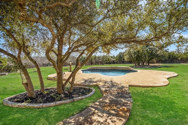 outdoor pool with a patio and a lawn