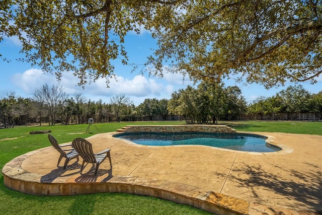 outdoor pool featuring a patio and a yard