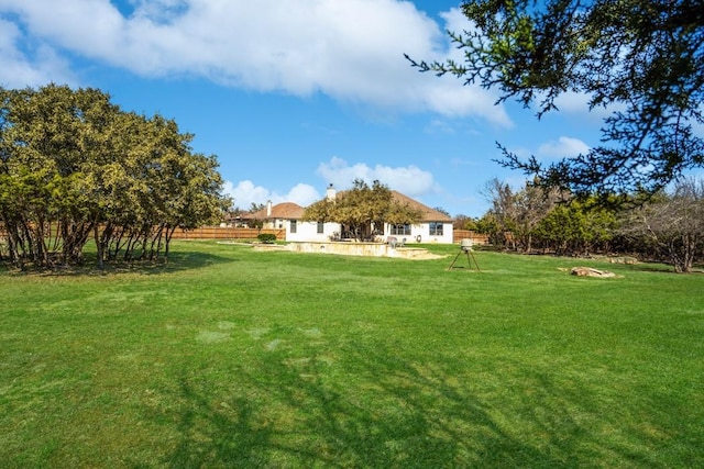 view of yard with fence