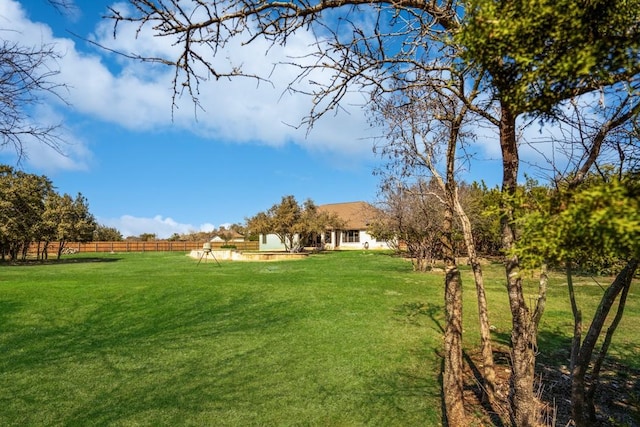 view of yard featuring a rural view and fence