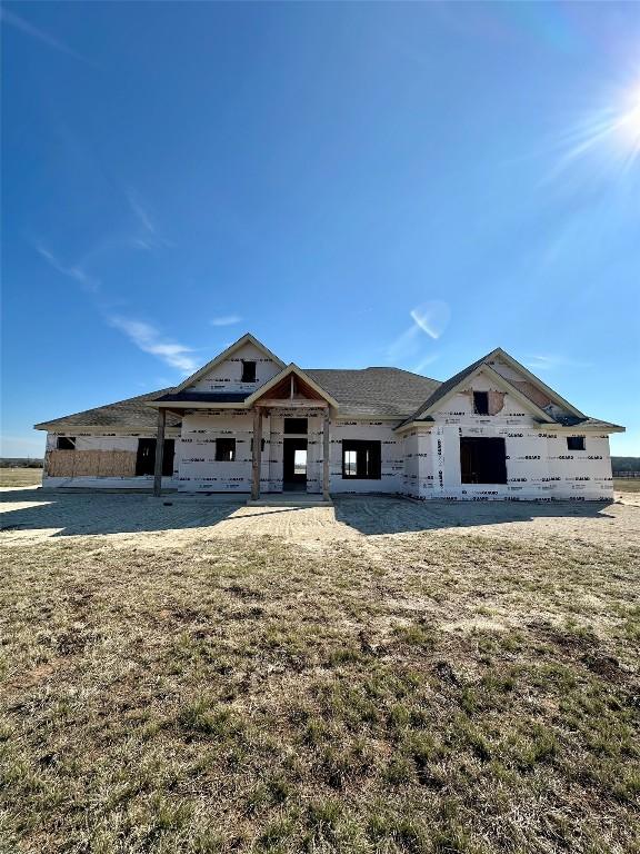 unfinished property featuring a front yard