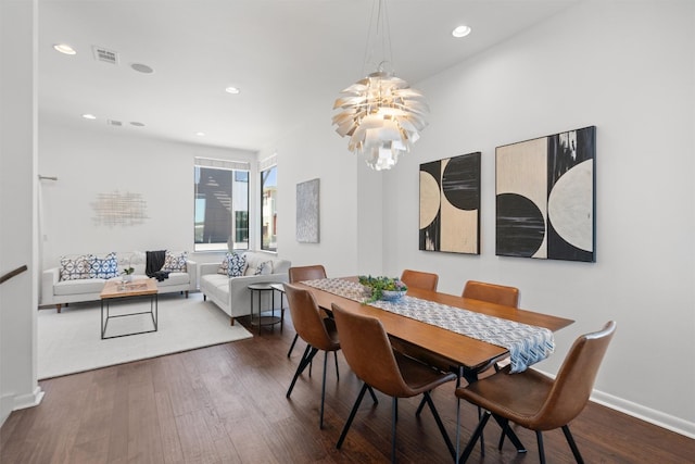 dining room featuring a chandelier, wood finished floors, visible vents, and recessed lighting