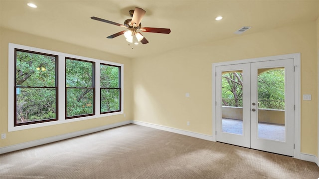 spare room featuring baseboards, visible vents, french doors, carpet floors, and recessed lighting