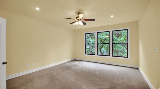 unfurnished room with carpet, ceiling fan, baseboards, and recessed lighting