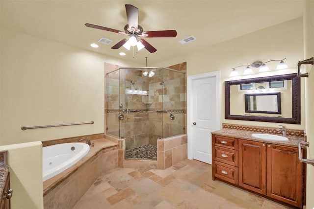 full bath with visible vents, a garden tub, vanity, and a shower stall