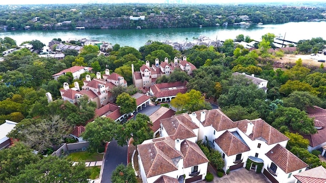 bird's eye view featuring a water view and a residential view