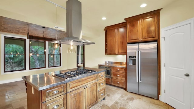 kitchen featuring appliances with stainless steel finishes, stainless steel countertops, island exhaust hood, and stone tile flooring