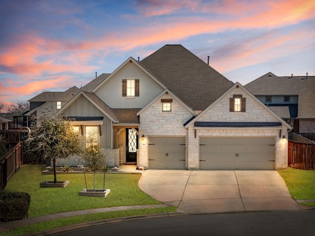 view of front of house featuring a garage, a yard, roof with shingles, and fence