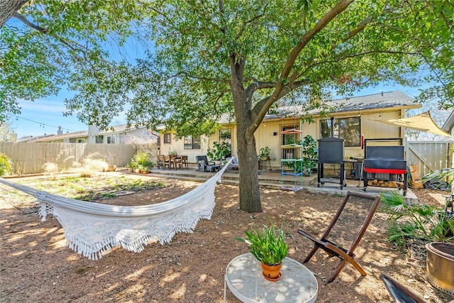 view of yard featuring a patio and fence