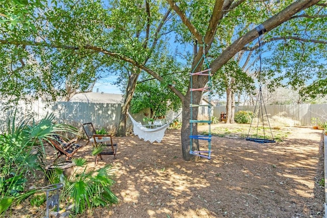 view of yard with a fenced backyard