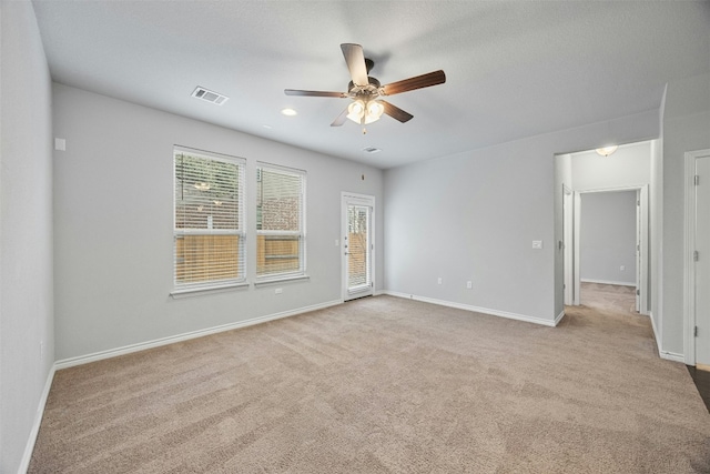 carpeted spare room with baseboards, visible vents, ceiling fan, and recessed lighting