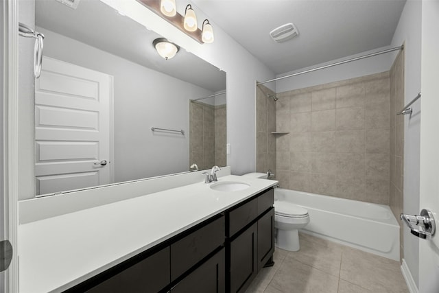 bathroom with visible vents, toilet, shower / tub combination, tile patterned floors, and vanity