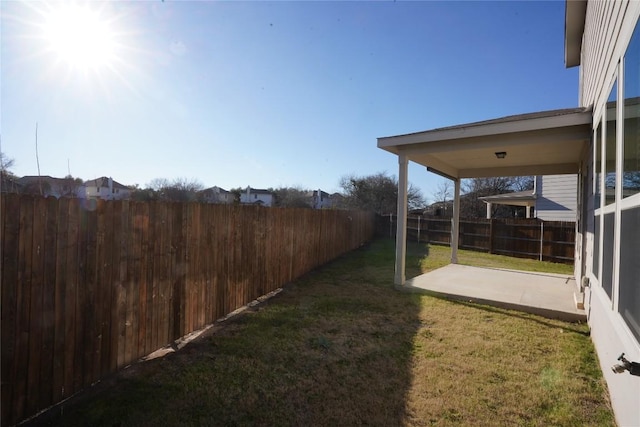 view of yard with a patio area and a fenced backyard