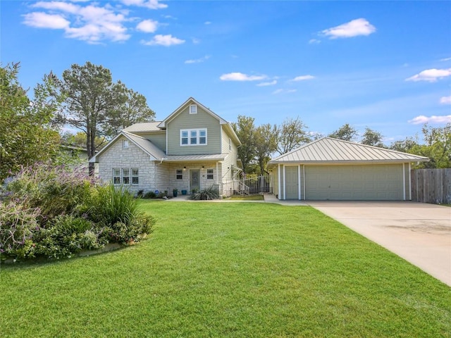 view of front of property featuring stone siding, metal roof, a standing seam roof, fence, and a front yard