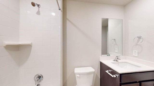 bathroom with toilet, washtub / shower combination, and vanity