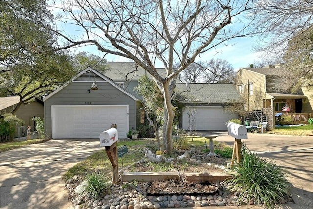 view of front facade with an attached garage and concrete driveway