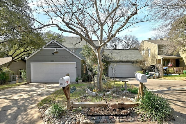 8102 Baywood Dr Unit A, Austin, TX 78759 - obstructed view of property with driveway and a shingled roof