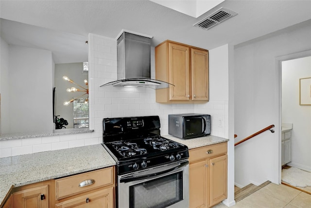 kitchen with black microwave, visible vents, wall chimney range hood, tasteful backsplash, and gas stove