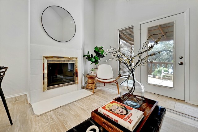 8102 Baywood Dr Unit A, Austin, TX 78759 - living room featuring a fireplace and wood finished floors