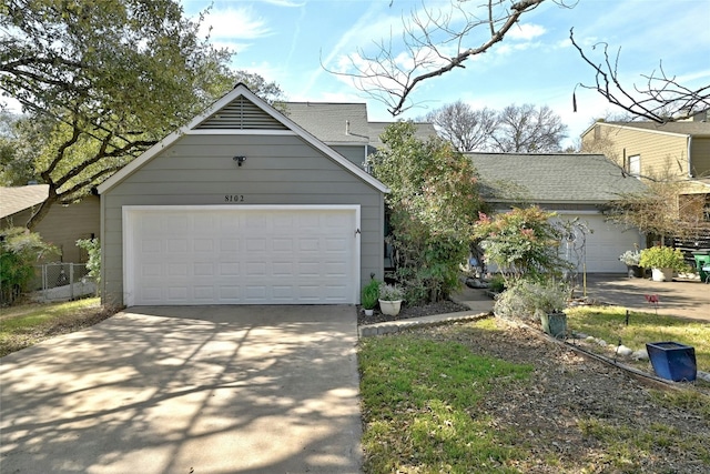 8102 Baywood Dr Unit A, Austin, TX 78759 - view of front of house featuring roof with shingles and concrete driveway