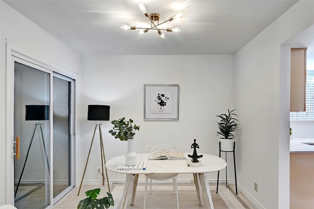 8102 Baywood Dr Unit A, Austin, TX 78759 - dining room featuring a chandelier and baseboards