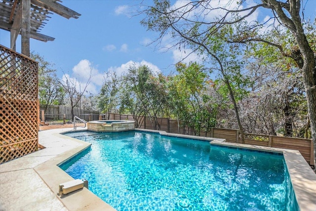 view of pool with a pool with connected hot tub and a fenced backyard