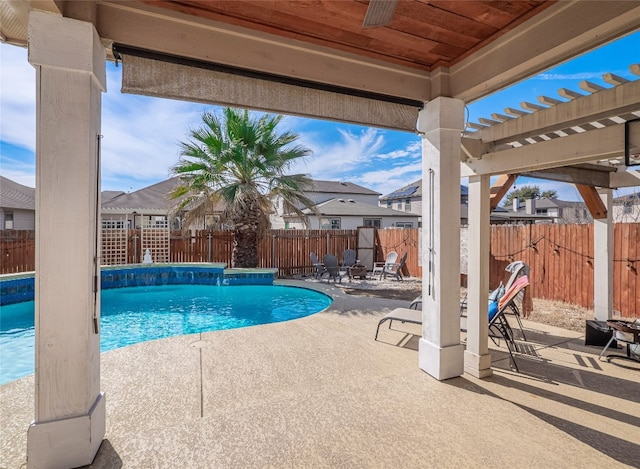 view of swimming pool with a fenced in pool, a patio area, a fenced backyard, and a pergola