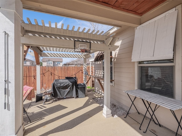 view of patio / terrace featuring fence, a pergola, and area for grilling