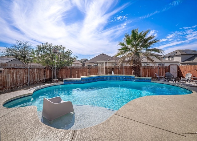 view of pool with a fenced in pool, a fenced backyard, and a patio