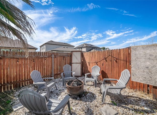 view of patio featuring a fire pit and a fenced backyard