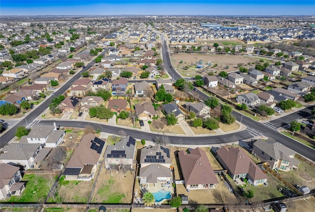 birds eye view of property with a residential view