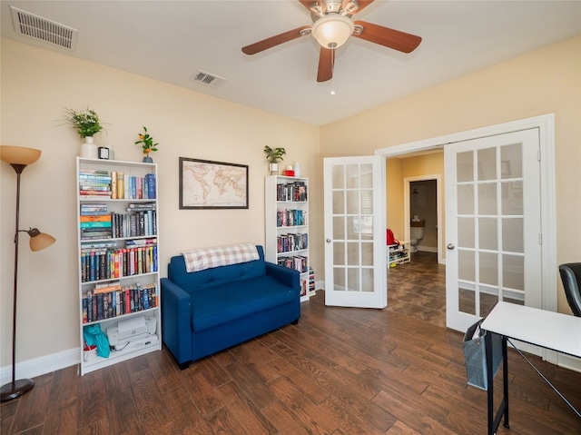 sitting room featuring french doors, wood finished floors, and visible vents