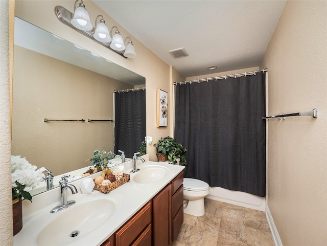 full bath featuring visible vents, a sink, toilet, and double vanity