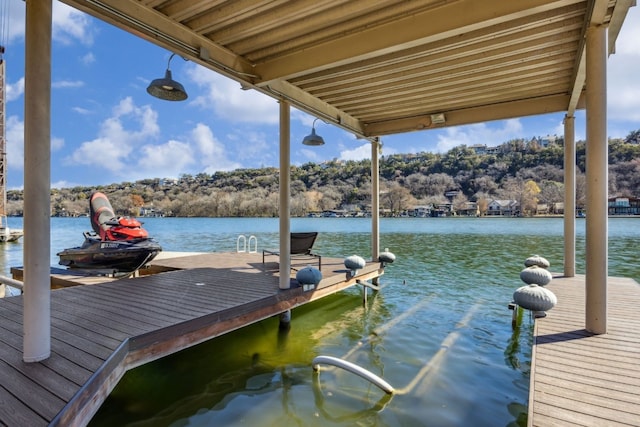 dock area with a water view