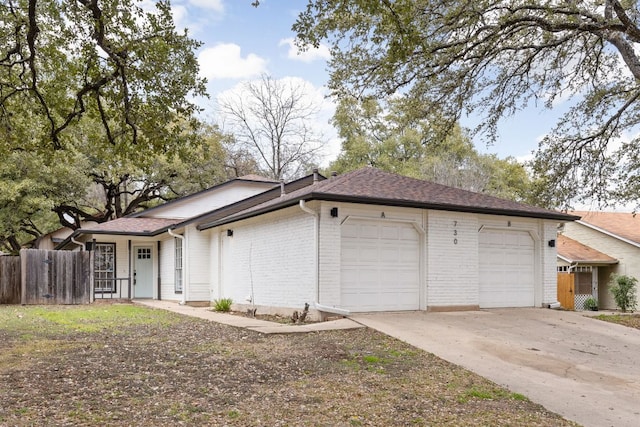 view of property exterior with brick siding, a shingled roof, concrete driveway, an attached garage, and fence