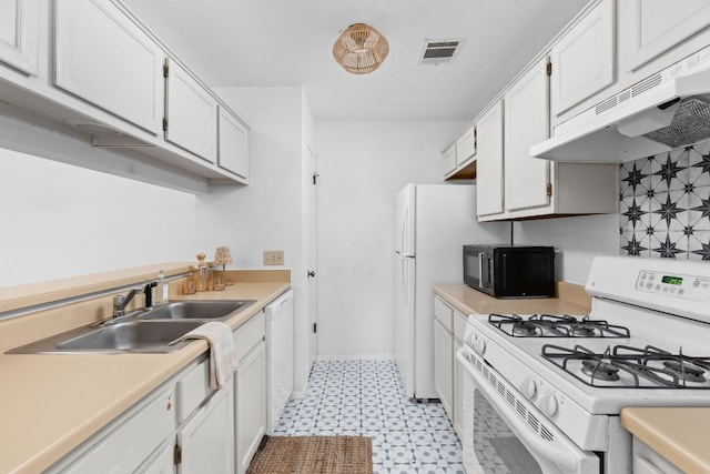 kitchen featuring light floors, visible vents, a sink, white appliances, and under cabinet range hood