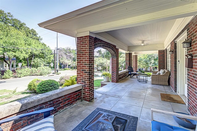 view of patio with a porch and a ceiling fan