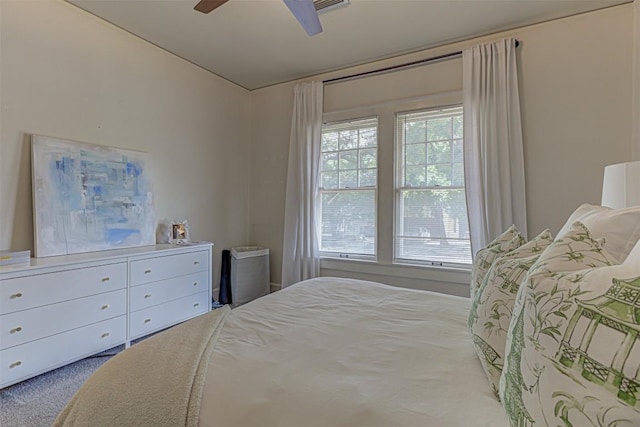 bedroom with ceiling fan and carpet flooring