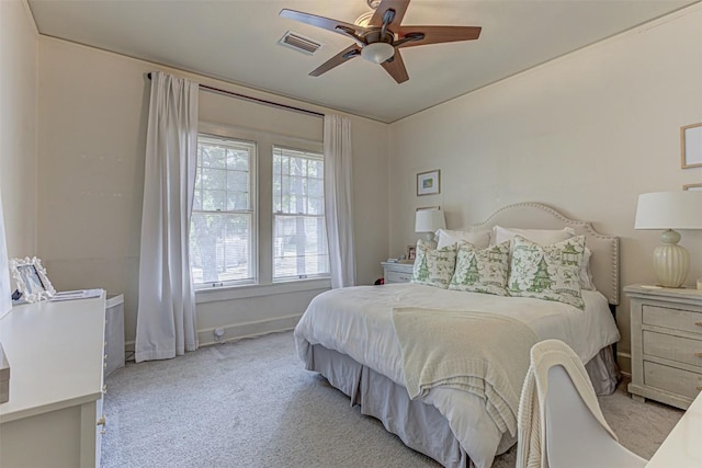 bedroom featuring carpet floors, visible vents, ceiling fan, and baseboards