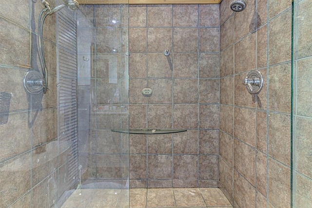 full bath featuring tiled shower