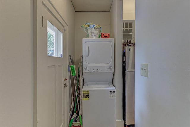 laundry room with laundry area and stacked washer / drying machine