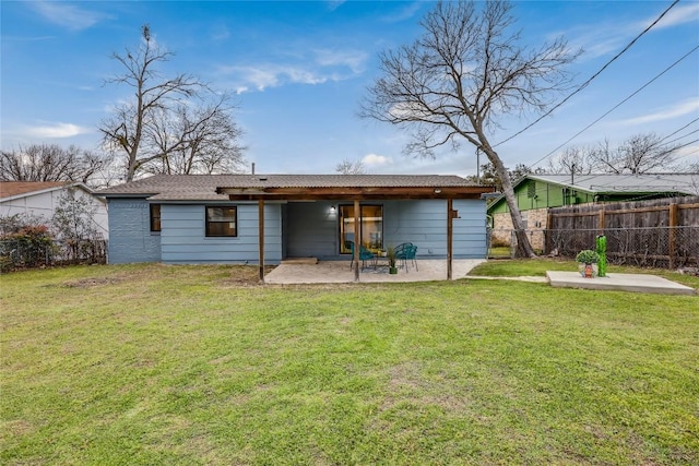 back of house with a patio area, fence, and a yard