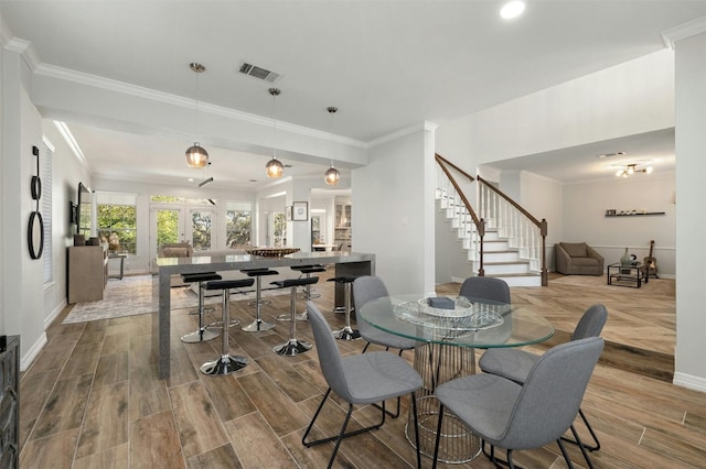 9288 Scenic Bluff Dr, Austin, TX 78733 - dining room with stairway, crown molding, baseboards, wood finished floors, and recessed lighting