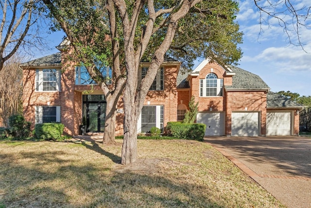 9288 Scenic Bluff Dr, Austin, TX 78733 - traditional home with driveway, a front yard, brick siding, and a shingled roof