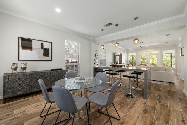 9288 Scenic Bluff Dr, Austin, TX 78733 - dining space featuring ornamental molding, wood finished floors, french doors, baseboards, and recessed lighting
