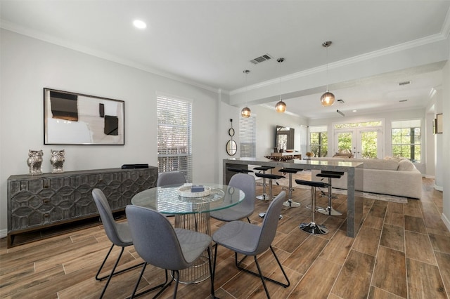 9288 Scenic Bluff Dr, Austin, TX 78733 - dining area with ornamental molding, wood finished floors, french doors, and recessed lighting